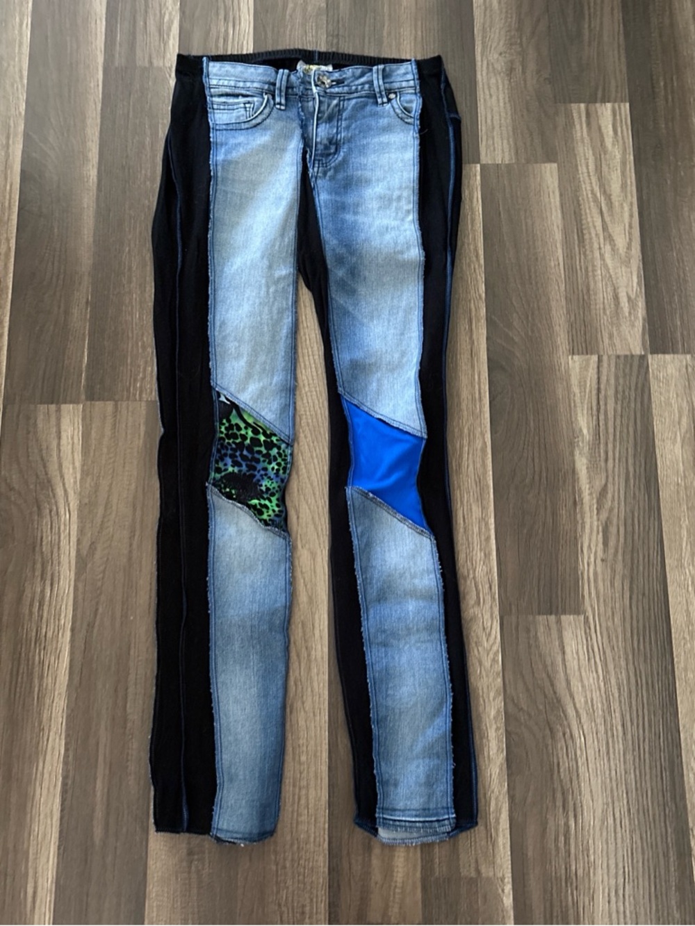 Styles ever after Blue and black patchwork jeans with multicolored print